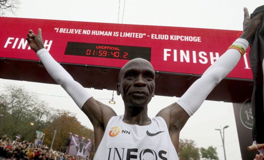 Eliud Kipchoge celebrates his record-breaking marathon under the clock.