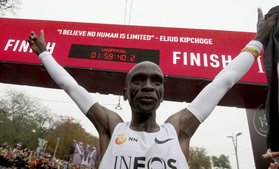 Eliud+Kipchoge+celebrates+his+record-breaking+marathon+under+the+clock.