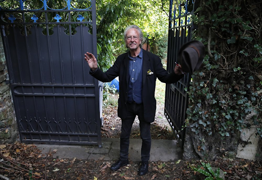 Peter Handke in front of his house in Cheville, France on 10/10/19. (AP Photo/Francois Mori)