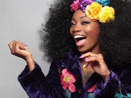 Black Women smiling with a flower crown, from https://pxhere.com/en/photo/597017