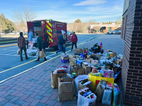 Service Club Members transport gifts with help from Brookside Fire Department, photo courtesy of Mrs. Brown.